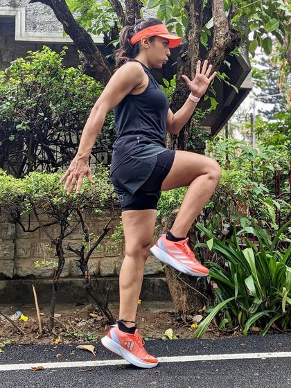 Performing running drills in my Adizero SLs. They are lightweight and responsive, making them great for speed work and form drills.