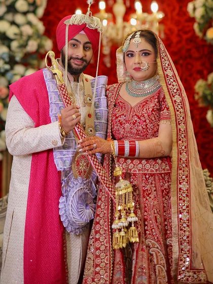 My bride Mansi with her groom. A classic portrait against a beautiful floral backdrop.