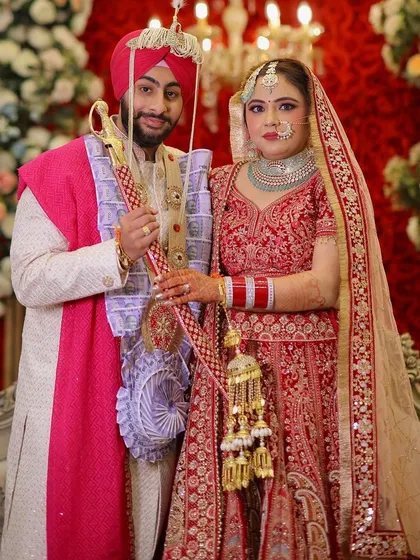 My bride Mansi with her groom. A classic portrait against a beautiful floral backdrop.