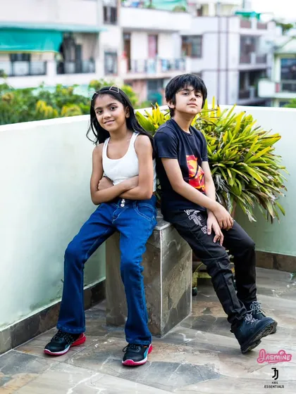 An outdoor lifestyle shot for a kids' jeans brand. This image captures the natural confidence and style of young models, demonstrating my experience in kids' fashion photography.