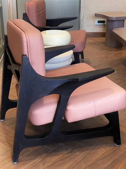 This custom armchair showcases the Japanese Shou-Sugi-Ban technique, where we burn the solid ashwood to enhance its durability and reveal a striking grain. Paired with pastel pink leatherette, it’s a perfect example of our Japandi-inspired work that blends texture and minimalism.