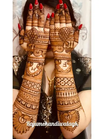 This design focuses on peacock and heart motifs, with the couple's initials on the forearms. It's a romantic take on traditional patterns.