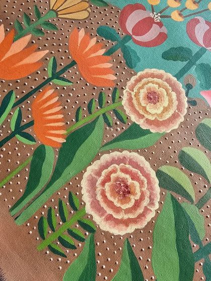 A close-up of the warm tones in this floral painting. The dotted texture in the background adds a subtle layer of detail and depth.