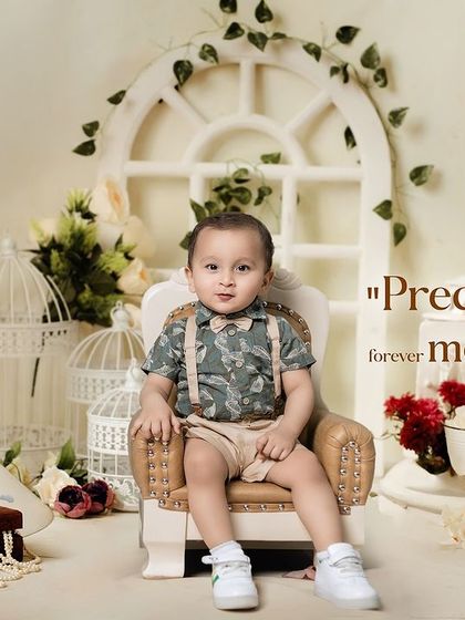 Precious moments, forever memories. A calm and classic portrait from a first birthday studio session with a vintage, romantic feel.