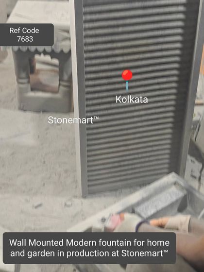 A wall-mounted modern fountain for home and garden in the final stages of production.