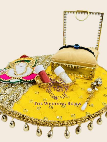 This bright yellow Rakhi tray with a Ganesha motif is perfect for adding a touch of auspiciousness to your Rakshabandhan ceremony.