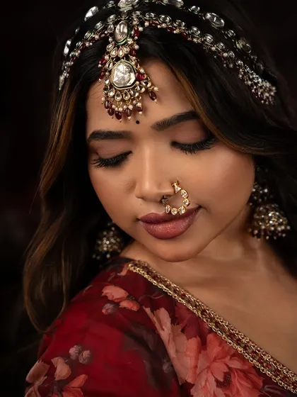A close-up of the makeup from my Heeramandi project. The eyes are softly smoked, the skin is luminous, and the lips are defined in a deep, romantic shade.
