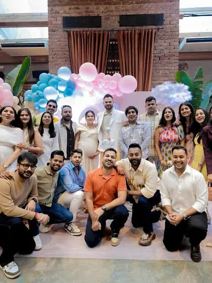 A wonderful group photo with friends and family. The joy and support surrounding the happy couple are palpable in this picture.