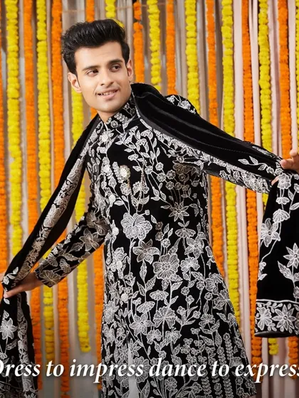 Dress to impress, dance to express. This black Indo-Western sherwani with stunning silver floral embroidery is a wedding masterpiece, designed for making a grand entrance.