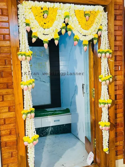 A closer view of the jasmine and floral mango pendant door hanging, highlighting the craftsmanship of the arrangement.