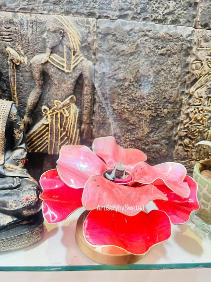 Here, the flower diya is being used as a dhoop (incense) holder, filling the space with fragrance and beauty.