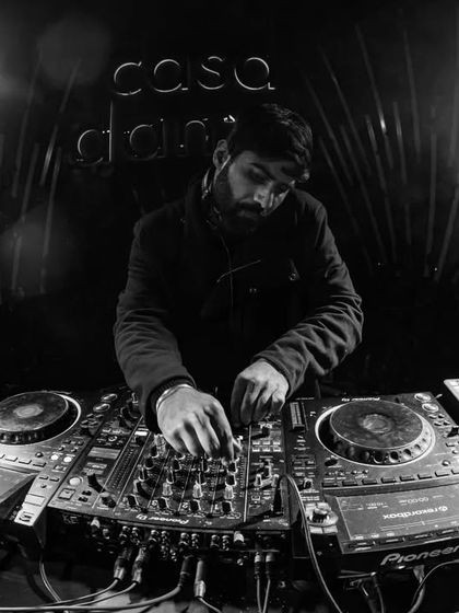 A black and white photo from the DJ booth, showing my focus on the decks. It's a craft that requires complete concentration.