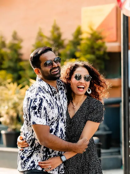 A candid laugh shared during an urban pre-wedding shoot. We believe the best photos come from genuine moments of joy and connection.