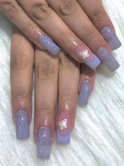 A soft lavender set with holographic glitter and delicate butterfly stickers for a dreamy look.