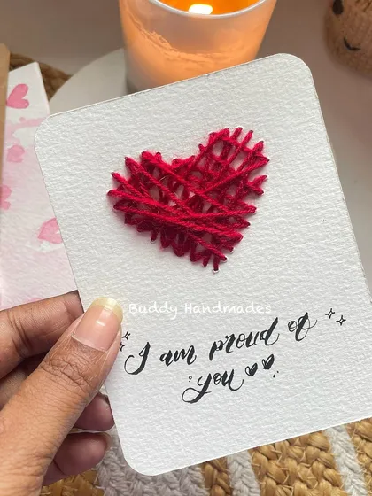 "I am proud of you." A powerful and loving message to send to a friend, partner, or family member, paired with a stitched heart.
