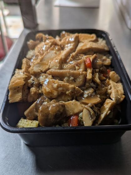 This is one of my ready-to-eat chicken meals, packed in a convenient container. It's perfect for taking to work or the gym, ensuring you have a healthy option available.