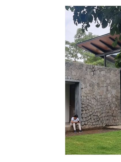 A quiet moment of contemplation at the 'House in a Grove'. The architecture provides simple, shaded spaces to sit and be with nature.