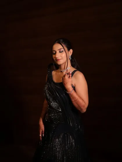 A serene moment captured. With her eyes closed, you can fully appreciate the soft glam eye makeup and the overall radiant finish of her look.