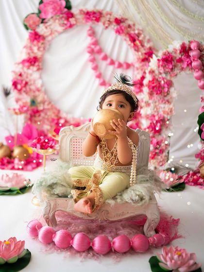 A playful moment as this little one pretends to drink from the butter pot.