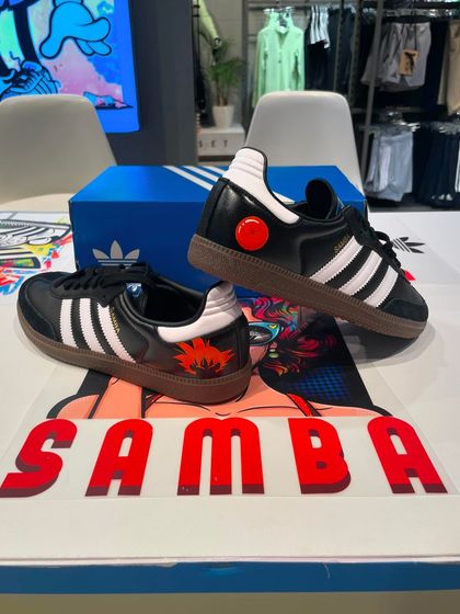 A pair of custom Adidas Sambas from our live event, featuring a Dragon Ball Z theme with the four-star dragon ball and Goku's flying nimbus cloud.