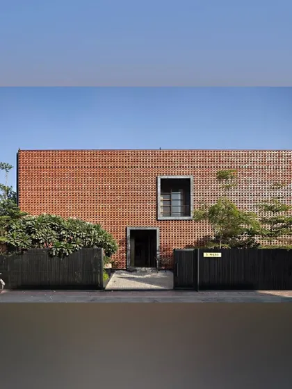 The entrance to the Ishtika house is defined by a stark brick facade and a simple black gate. We used minimalist planting to soften the entrance without distracting from the powerful architecture.