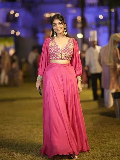 This pink co-ord set with an embroidered blouse and flowing skirt is a modern and chic choice for a sangeet or reception. It's comfortable enough to dance in all night.