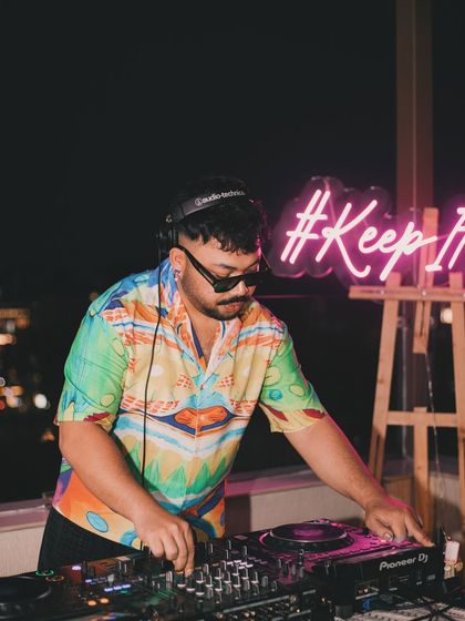 DJ Varun setting the mood at the Lush Loft 'End Of The World' party. The theme for the DJs was to play tunes close to their hearts, moving beyond typical club bangers to create a more personal and eclectic soundscape.