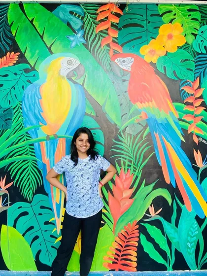 This vibrant tropical mural featuring two large macaw parrots was a joy to create. The bold colors and dense foliage on a black background make for a dramatic and stunning photo point in a restaurant.