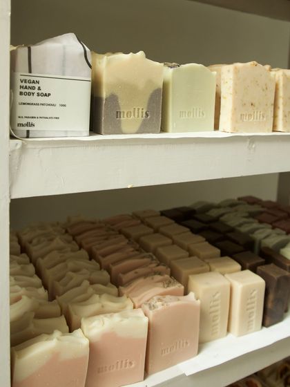 Close-up of the curing shelves, where soaps sit for weeks to harden and become milder.