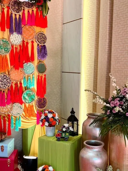 A close-up of the traditional decorative elements, including colorful dreamcatchers with tassels and vintage-style trunks, adding a unique and cultural touch.
