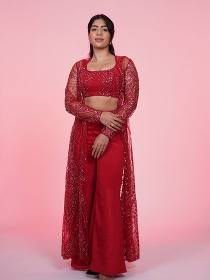 A full-length view of the red three-piece Indo-Western set, a bold and unforgettable look.