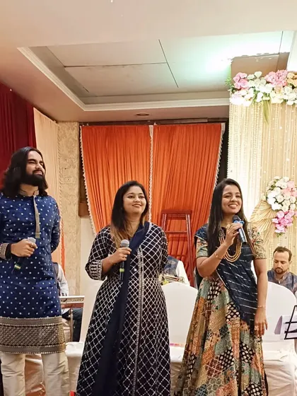 My team of singers performing on stage, their voices adding a divine touch to the wedding rituals.