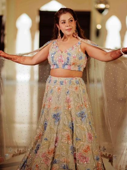 Ready to glow for her Haldi. This bride looks radiant in her pastel lehenga, with makeup that is fresh, dewy, and waterproof.