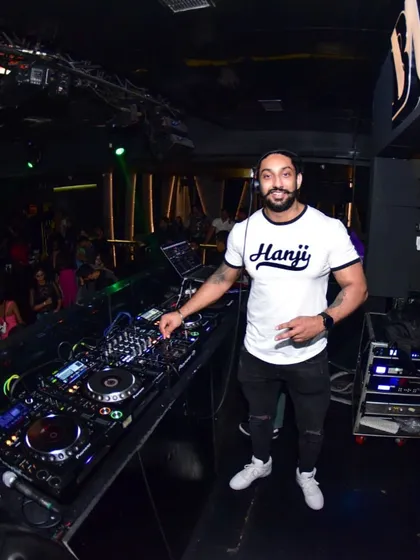 Rocking a "Hanji" t-shirt at the console. My Punjabi roots are a big part of my musical identity, and I love dropping Bhangra bangers.