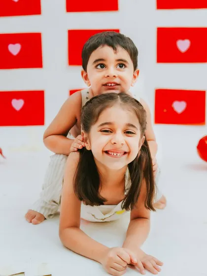 A playful moment between brother and sister. These fun, candid shots are just as important as the posed ones.