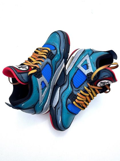 Another angle of the Dragon Ball Z Air Jordans, showing how the design flows across the different panels of the shoe.