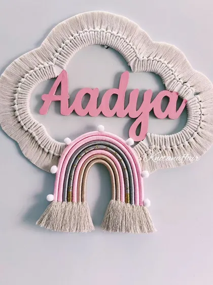 I absolutely love making these personalized macrame cloud and rainbow wall hangings. This piece for little Aadya was made with soft pinks and earthy tones, creating a dreamy and unique decoration for her nursery. I can customize the name, colors, and size to make it perfect for your child's room.