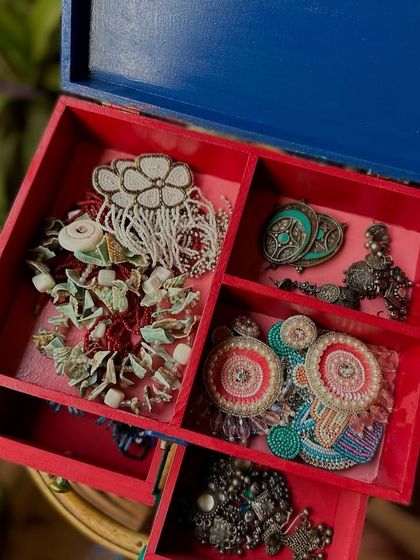 The inside of our jewelry box, with compartments to keep all your precious items organized.