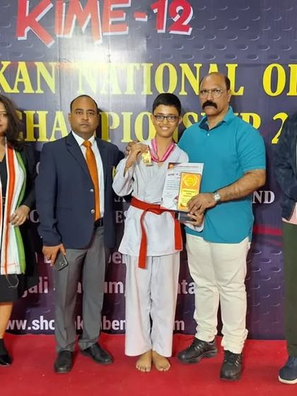 A student receives her award at the Shorinkan National Open Karate Championship in Kolkata. Our federation supports students participating in championships across the country.