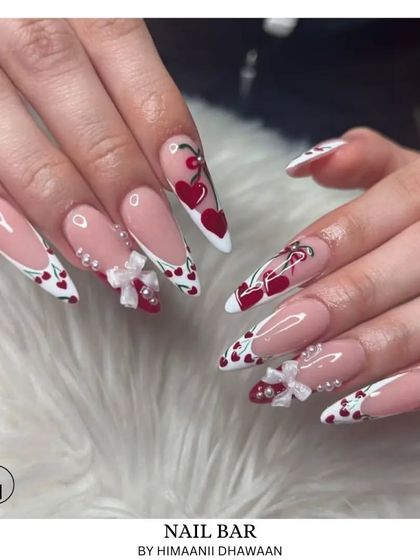 A super cute and detailed set with cherry patterns, 3D bows, and heart-shaped French tips. This shows our skill in creating playful, intricate designs.