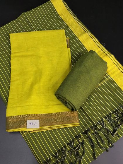 A bright and cheerful linen cotton dress material in shades of lime green. The striped dupatta with tassels adds a playful touch to this simple and elegant set.