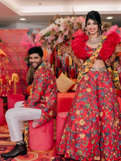 A fun and happy portrait of the couple at their Mehendi. The decor was designed to be as bright and cheerful as they are.