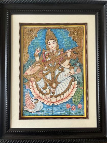 A beautiful Mysore painting of Goddess Saraswathi with her swan, symbolizing purity and wisdom. The intricate detailing and rich gold leaf work add a divine aura to this piece.