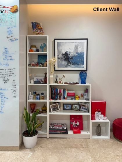 Turning a blank wall into a statement of art. This abstract piece adds a splash of color and energy to a client's workspace, integrating beautifully with their personal collection of books and objects.