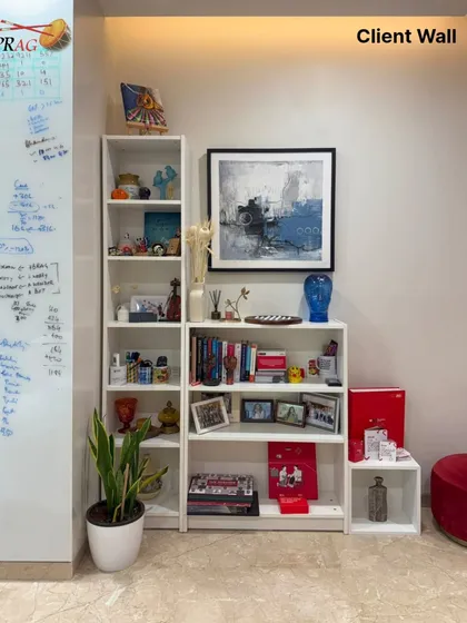 This abstract piece with cool blue and white tones is perfectly integrated into a modern shelving unit, proving that art can be a seamless part of your functional decor.