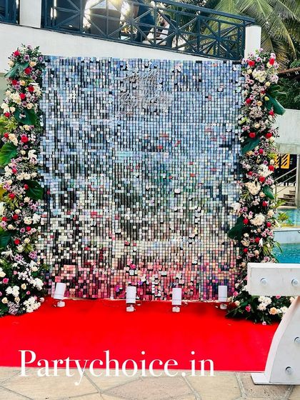 The sequin wall backdrop with a custom "75" marquee number, creating the perfect spot for birthday photos.