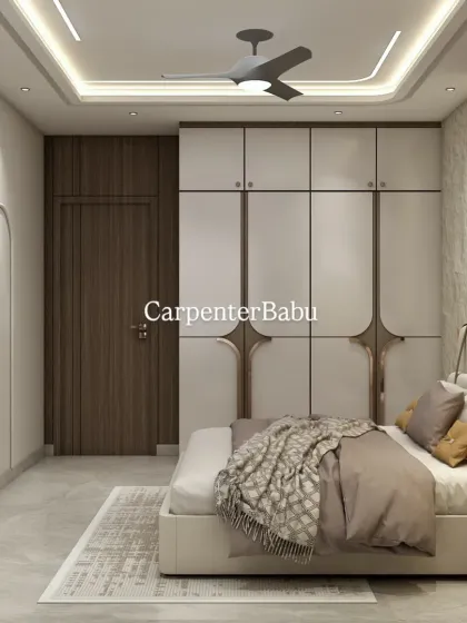 This view shows the full-wall wardrobe with its unique curved handles, adding a soft, organic touch to the modern design.
