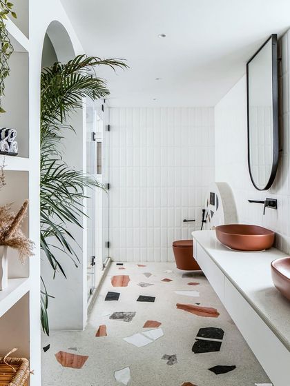 A full view of the master bathroom, showcasing the spacious layout, double vanity, and the seamless connection to the walk-in closet.