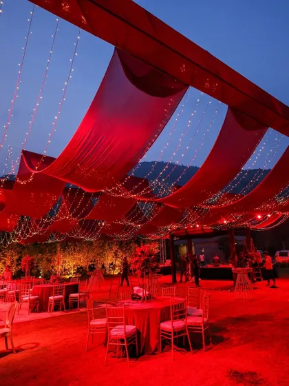 We believe a reception should feel like a galaxy of joy. For this night, we draped the sky in rich red fabric and a constellation of fairy lights, creating a warm, vibrant space where guests could share laughter and make memories under the stars.