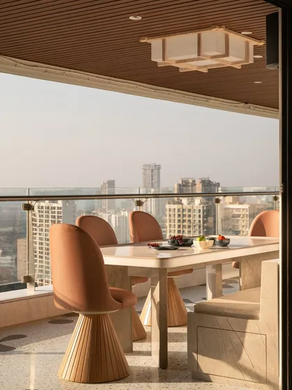 For this sea-facing Mumbai terrace, we designed a serene escape with a custom daybed and a sleek, reversible swing. The furniture is designed to be both durable for the outdoors and elegant enough to complement the stunning city views, creating a perfect spot for lazy afternoons or lively evenings.